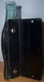 Coke handle mounted on door bracket
